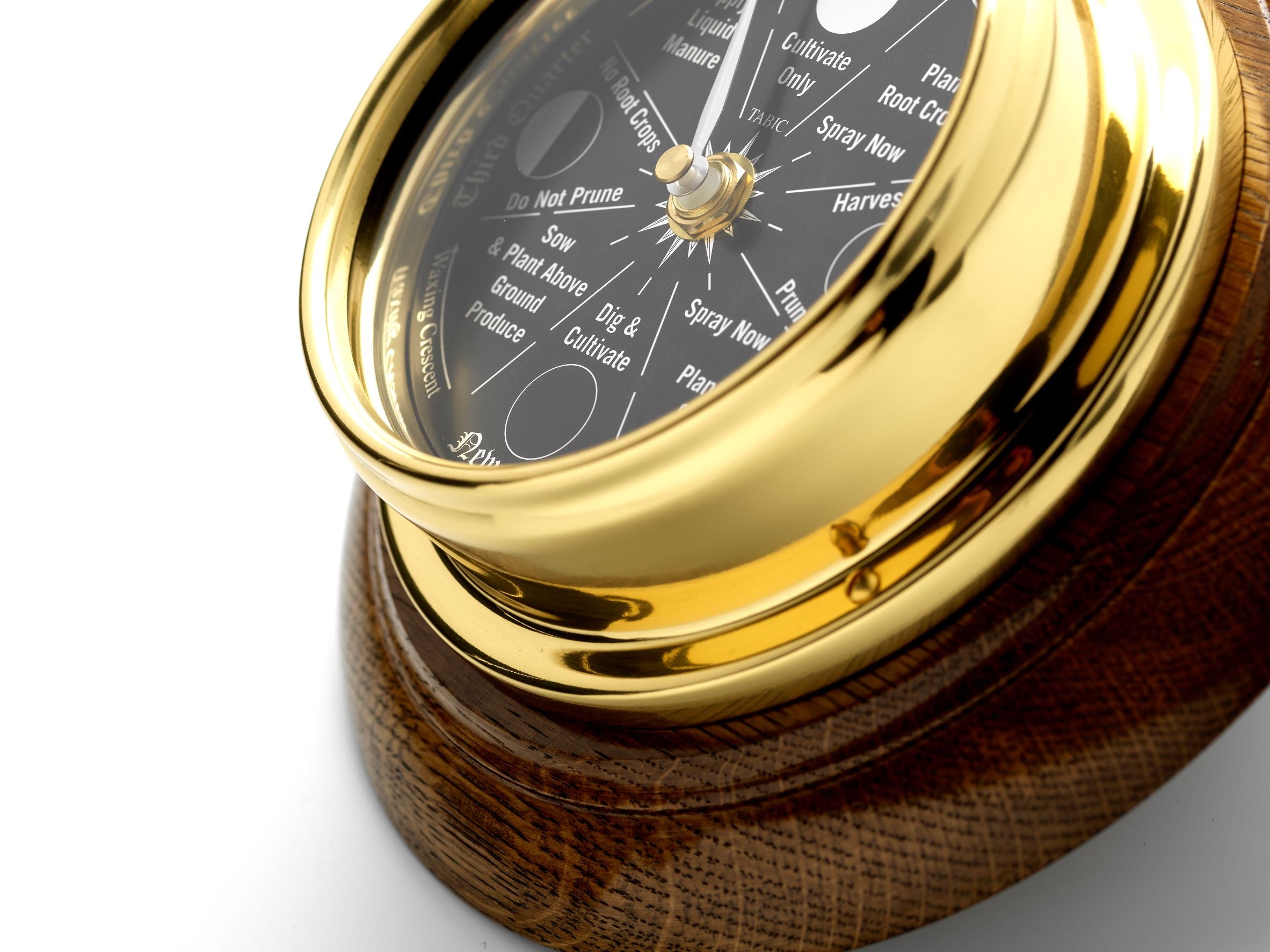 Prestige Brass Moon Gardening clock with A jet Black Mirrored Aluminium Dial, Mounted on a Solid English Dark Oak Wall Mount