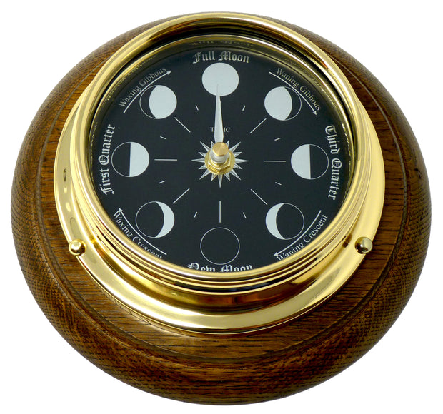 Prestige Brass Moon Phase Clock With a Jet Black Dial Mounted on a Solid English Dark Oak Wall Mount - TABIC CLOCKS