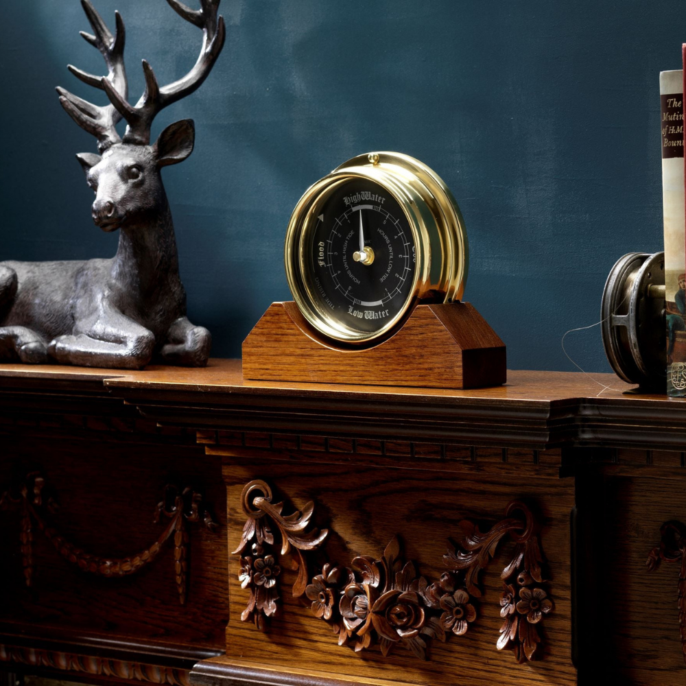 Handmade Prestige Tide Clock in Solid Brass With a Jet Black Dial, mounted on a solid English Dark Oak Mantel/Display Mount