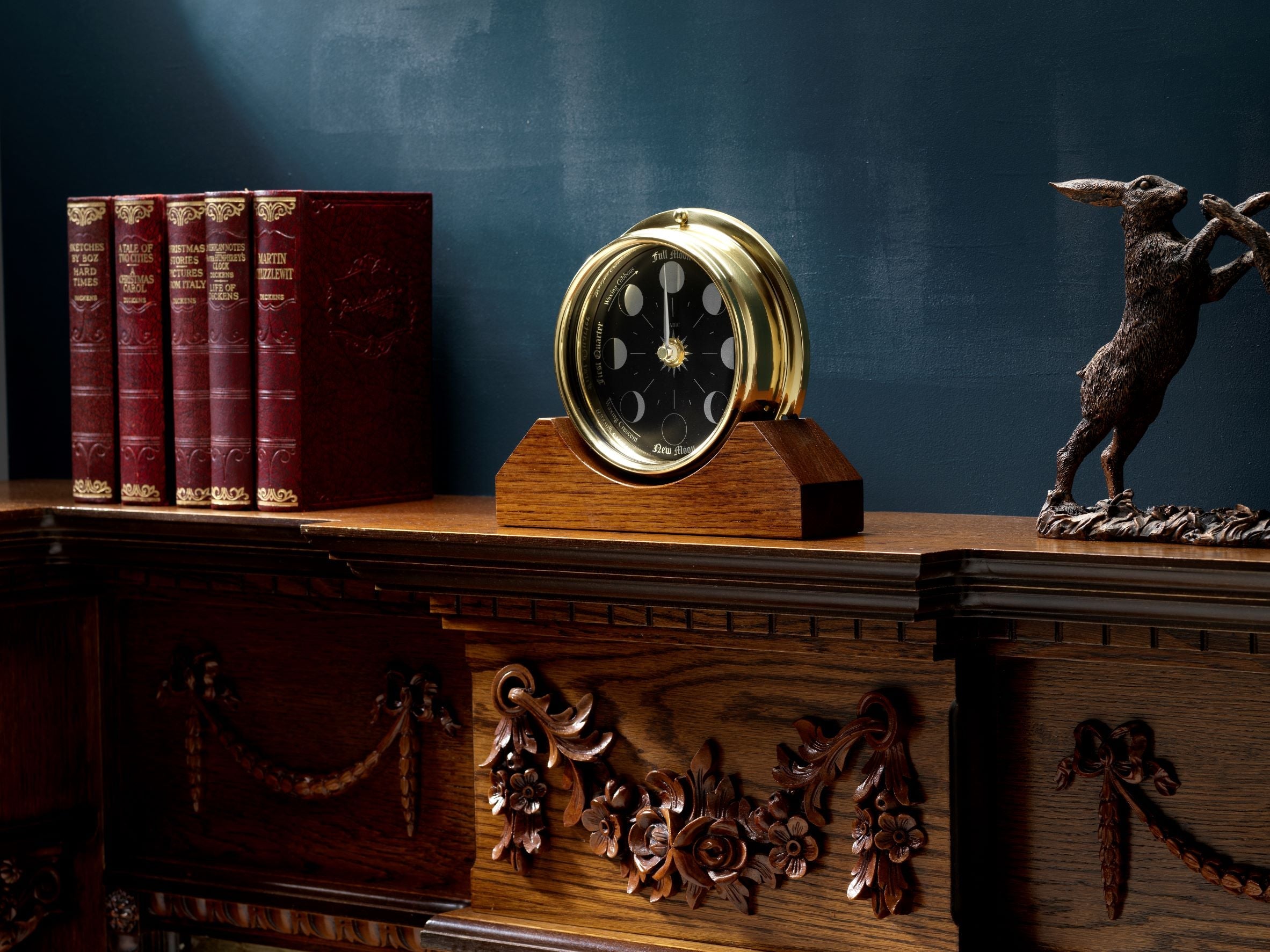 Prestige Brass Moon Phase Clock With a Jet Black Dial Mounted on a Solid English Dark Oak Mantel/Display Mount - TABIC CLOCKS