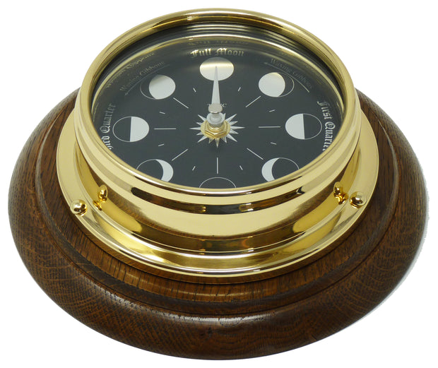 Prestige Brass Moon Phase Clock With a Jet Black Dial Mounted on a Solid English Dark Oak Wall Mount - TABIC CLOCKS